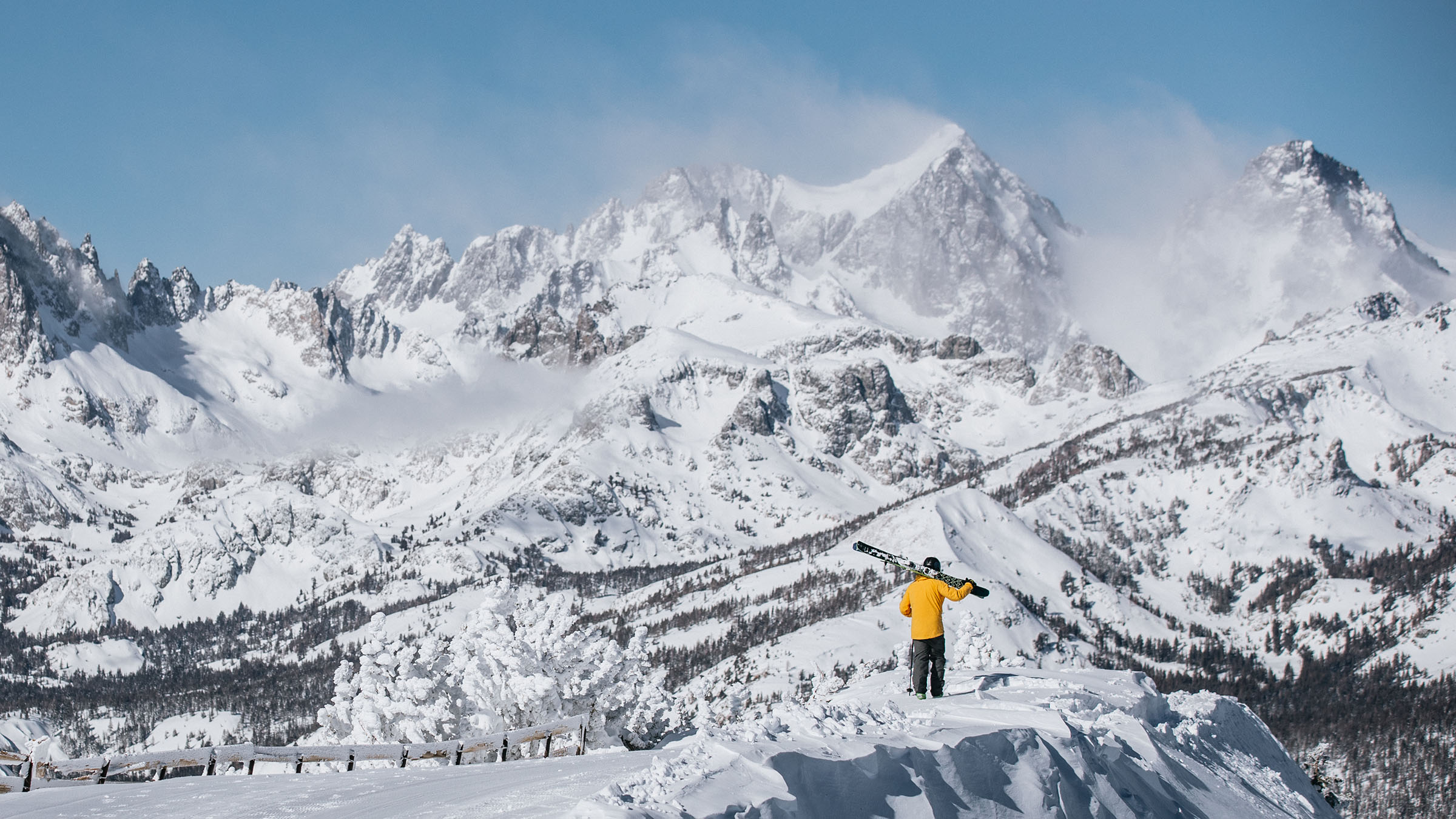 Mammoth Mountain in the winter, dramatic image with snowboarder looking out